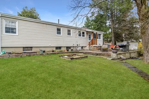 a front view of house with yard and seating area