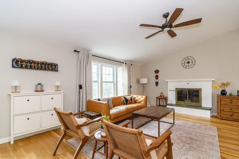 a living room with a couch and a fireplace