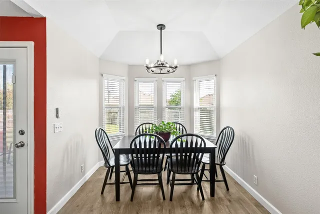 a kitchen with a stove a sink and a microwave