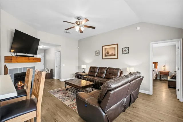 a dining room with furniture and wooden floor