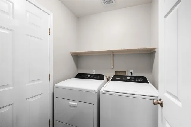 a spacious bathroom with a mirror and a shower