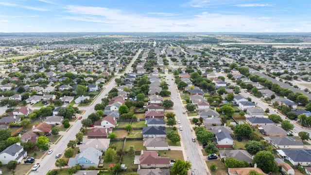 an aerial view of residential building with parking space