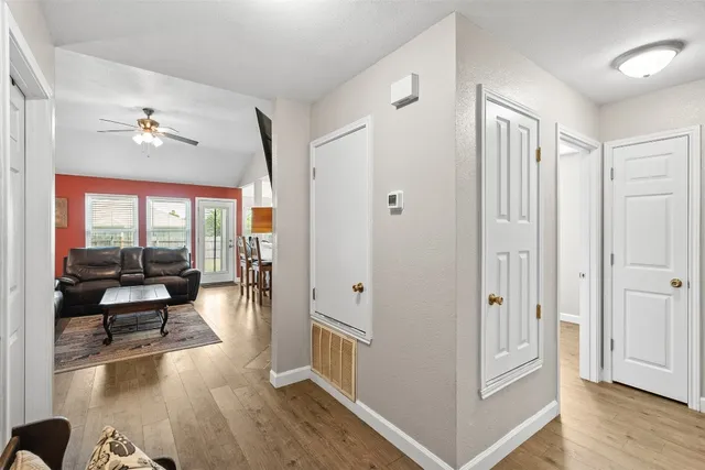 a view of a livingroom with furniture and hardwood floor