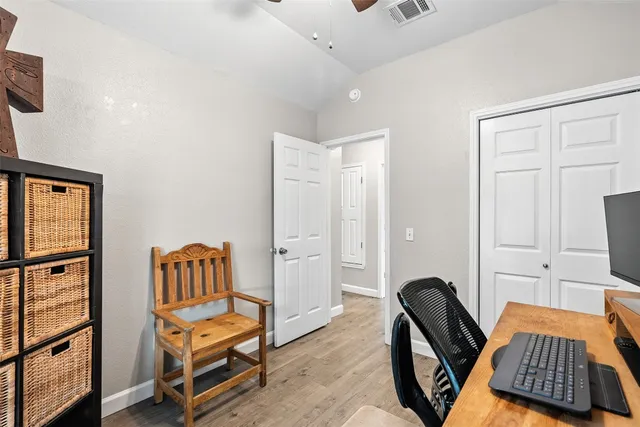 a bedroom with furniture and a window