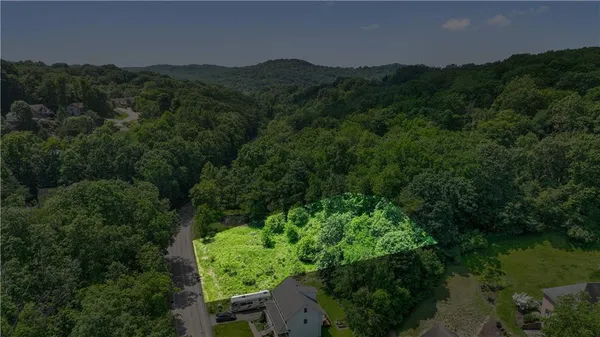 an aerial view of a house with mountain view