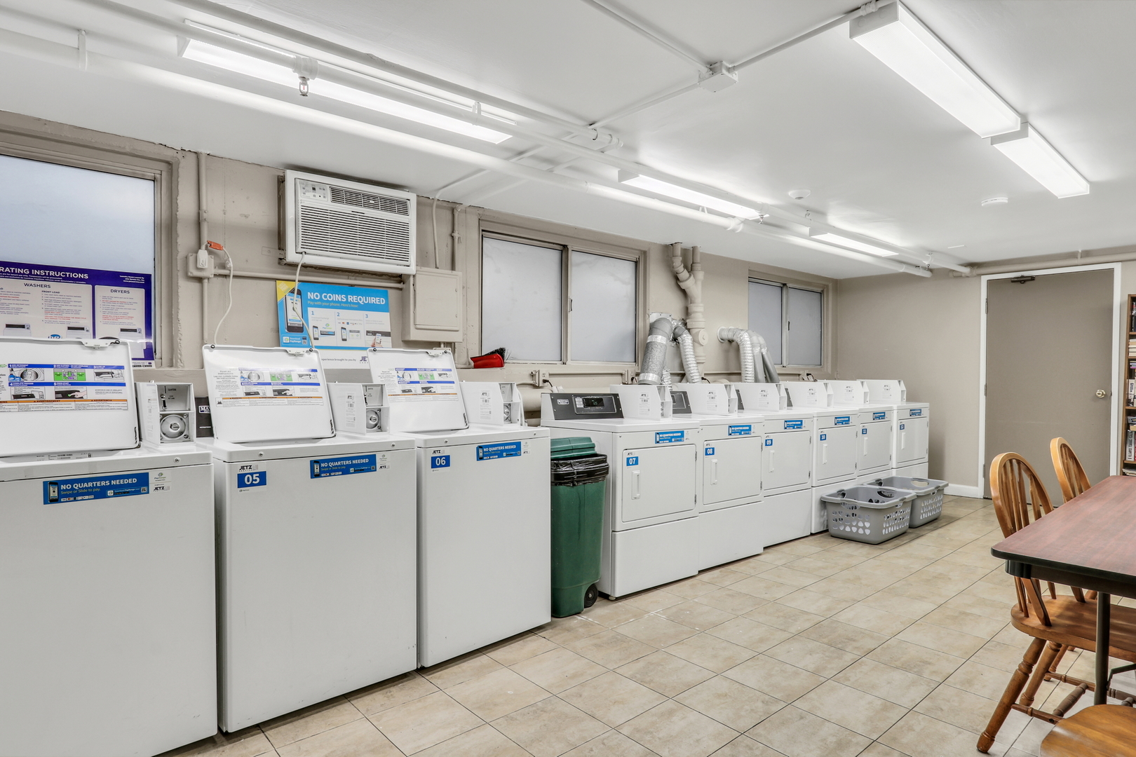 8620 Waukegan Road, Unit 107 Morton Grove, IL 60053 - Photo 15 of 18 a kitchen with cabinets and window