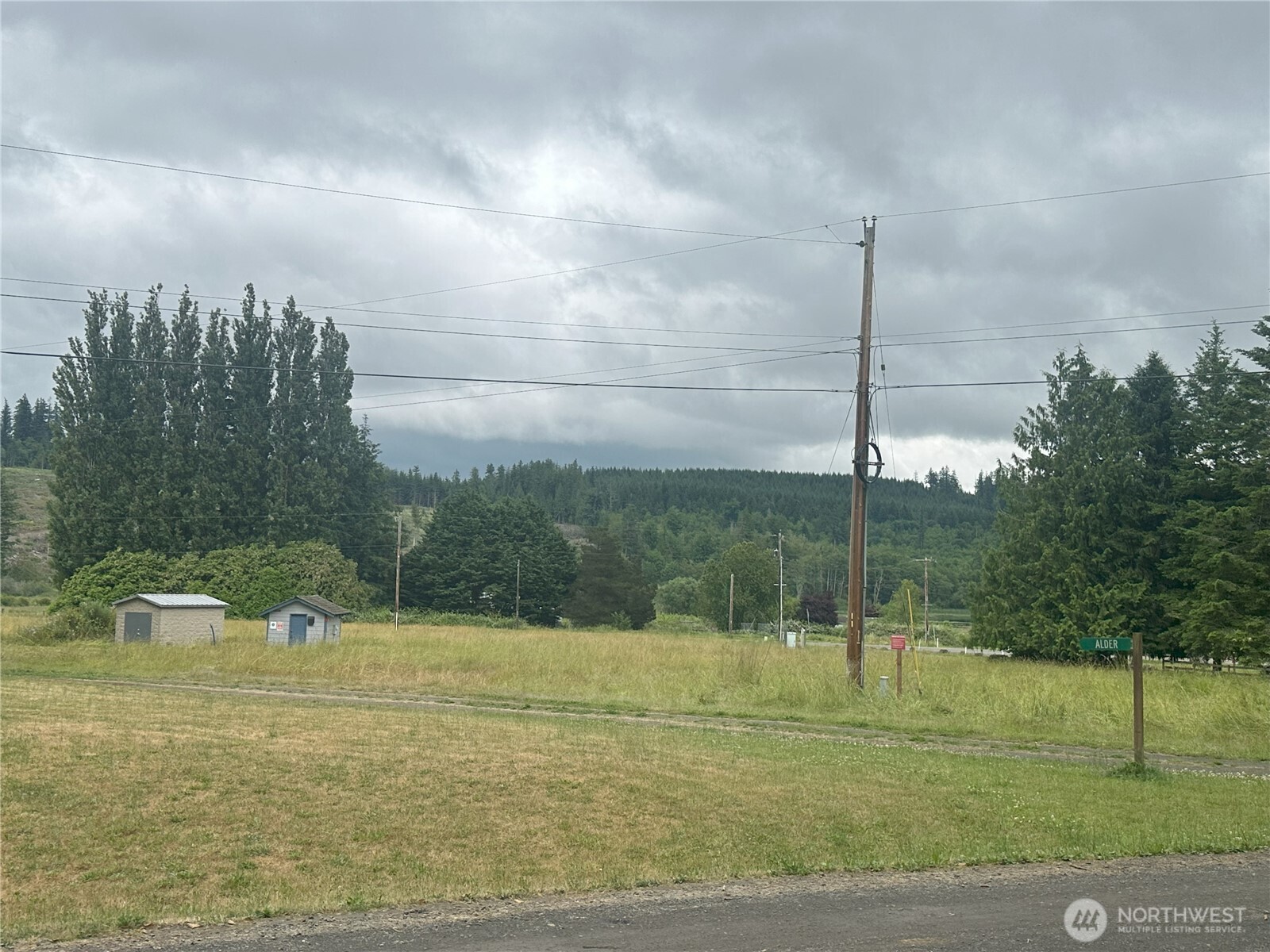 0 Skidder Hill Road Quilcene, WA 98376 - Photo 9 of 13 a lake view with a play ground in the back