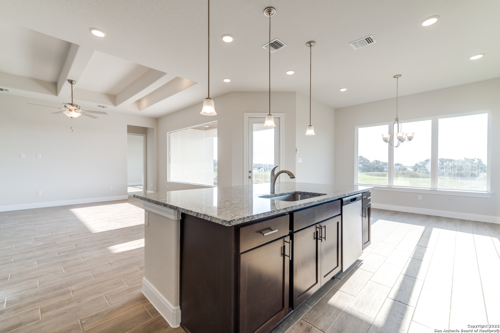 238 Peter Kleid Loop Blanco, TX 78606 - Photo 1 of 25 a kitchen with stainless steel appliances granite countertop a sink a counter space and a window