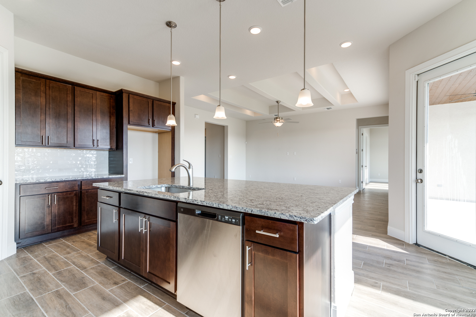 238 Peter Kleid Loop Blanco, TX 78606 - Photo 6 of 25 a kitchen with a sink a counter space appliances and cabinets