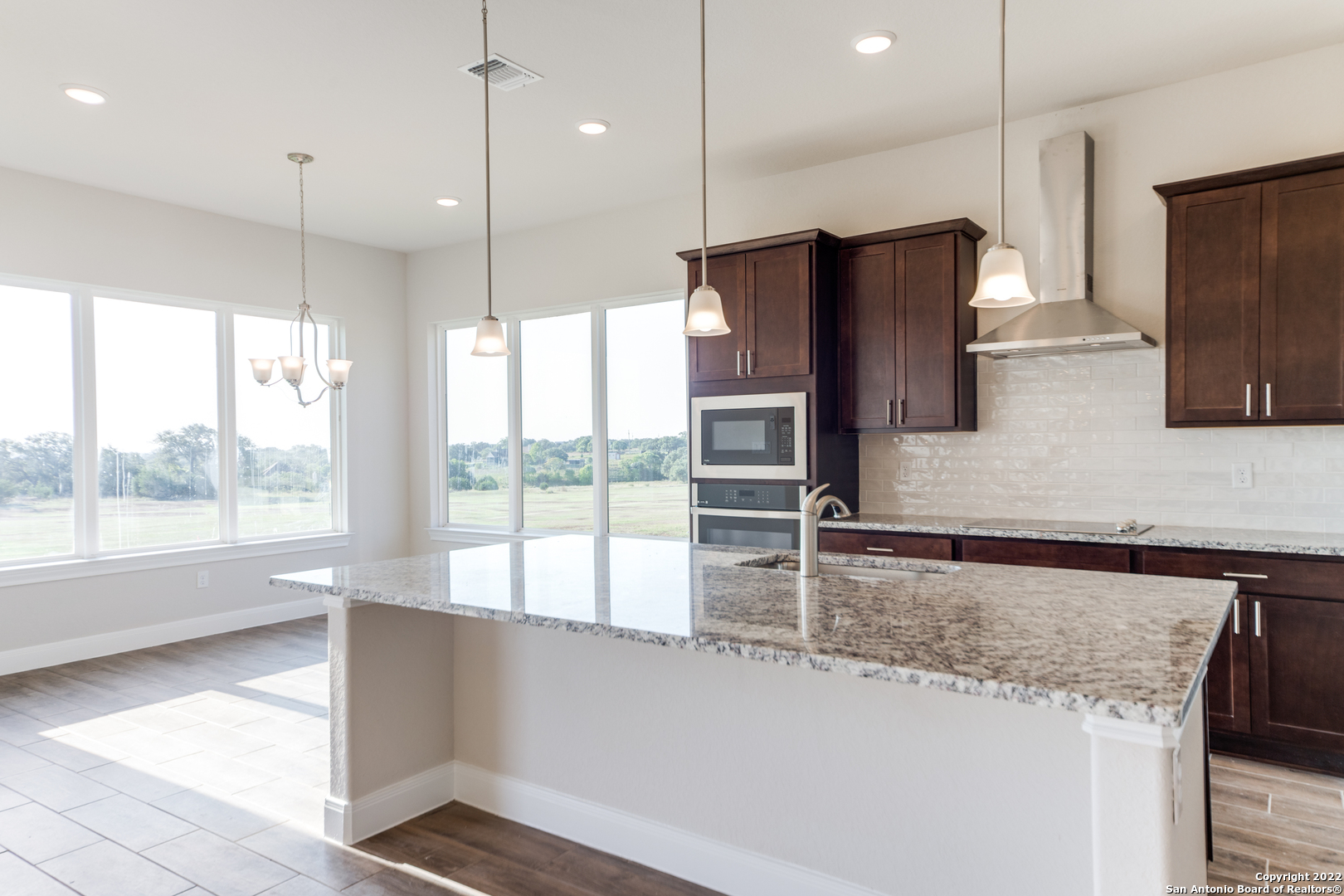 238 Peter Kleid Loop Blanco, TX 78606 - Photo 10 of 25 a kitchen with stainless steel appliances granite countertop a refrigerator a sink and a stove