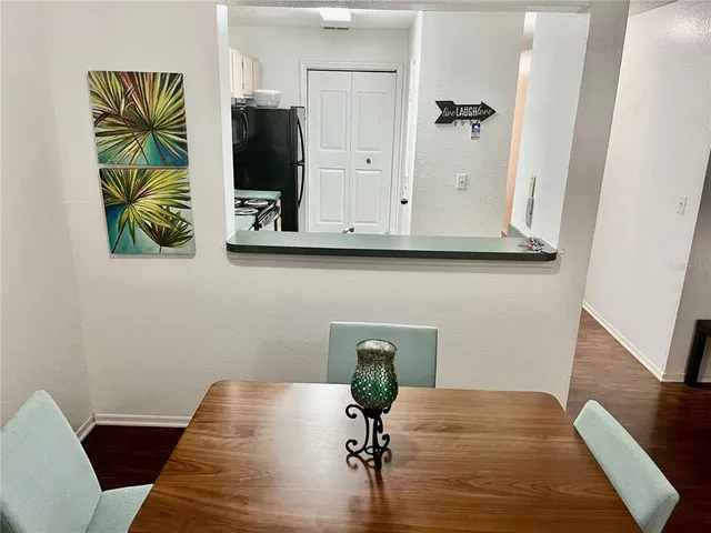 a view of living room with furniture and wooden floor