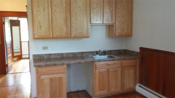 81 Winter Street Bellingham, MA 02019 - Photo 13 of 20 a kitchen with granite countertop white cabinets and sink