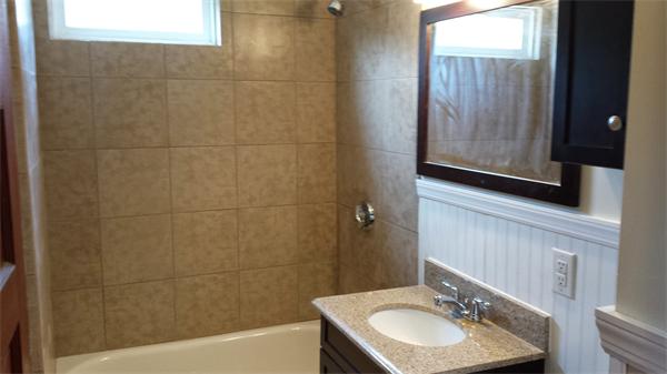 81 Winter Street Bellingham, MA 02019 - Photo 17 of 20 a bathroom with a sink and a mirror