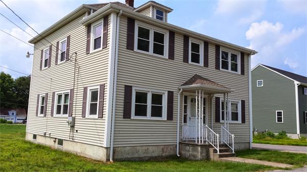 81 Winter Street Bellingham, MA 02019 - Photo 2 of 20 a front view of a house with a garden