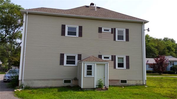 81 Winter Street Bellingham, MA 02019 - Photo 3 of 20 a front view of a house with a yard