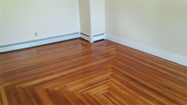 81 Winter Street Bellingham, MA 02019 - Photo 6 of 20 a view of an empty room with wooden floor