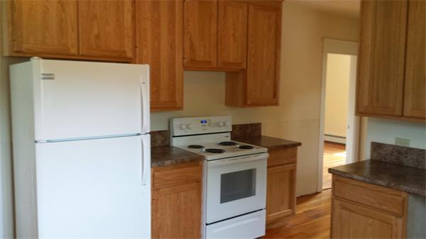 81 Winter Street Bellingham, MA 02019 - Photo 8 of 20 a kitchen with a stove and a refrigerator