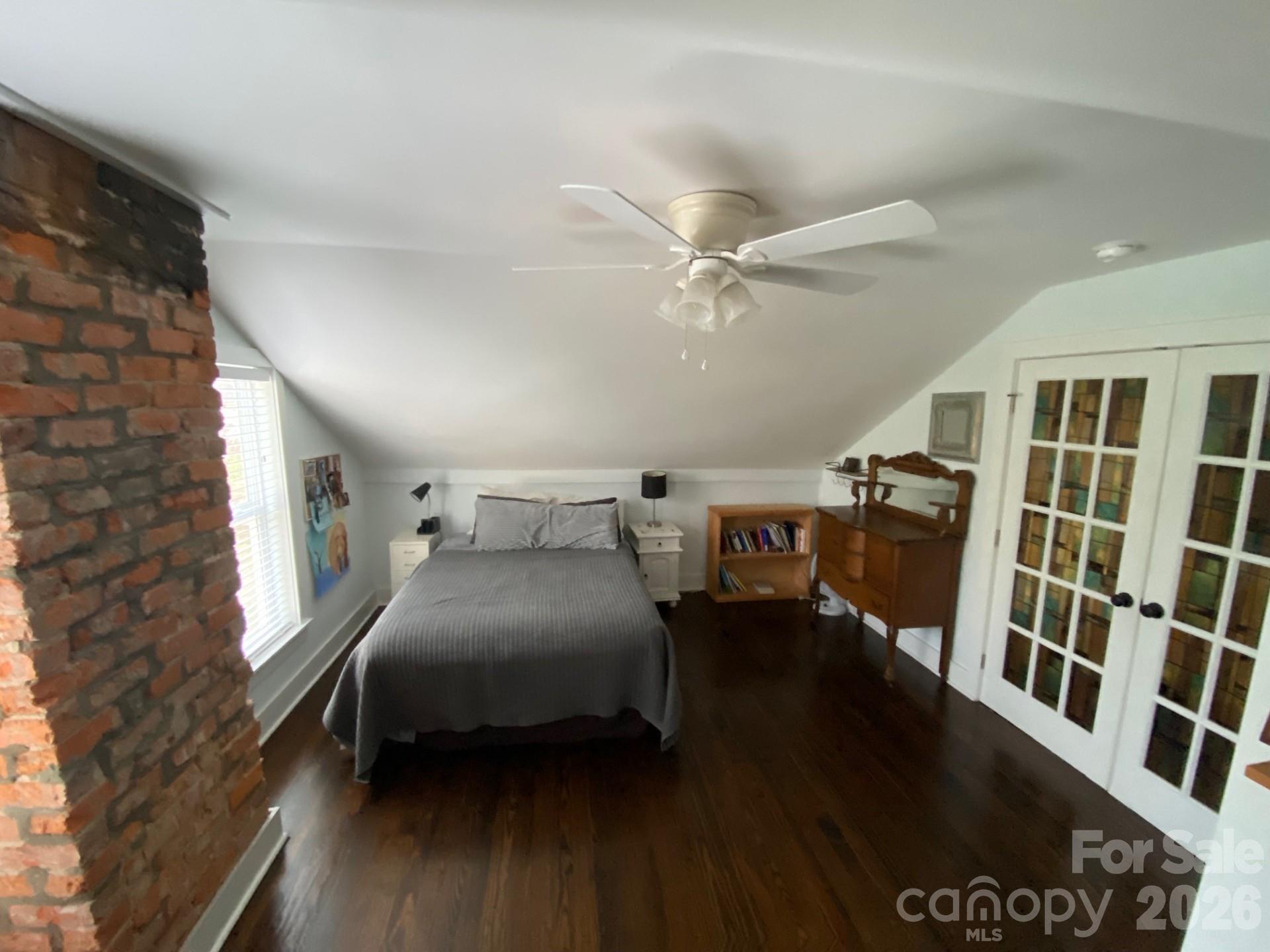 201 Main Street Matthews, NC 28105 - Photo 14 of 16 a bedroom with furniture and a window