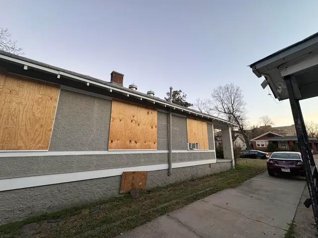 a view of a car park in front of house