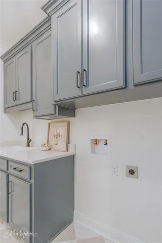a view of a sink with cabinets