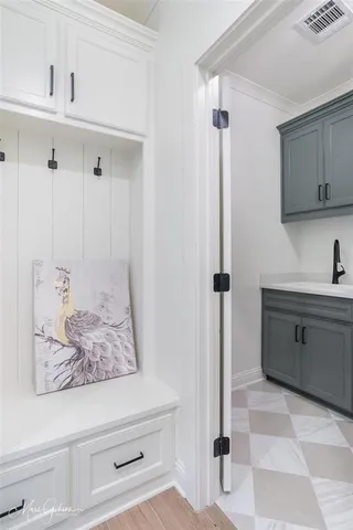 a bathroom with a tub sink and mirror