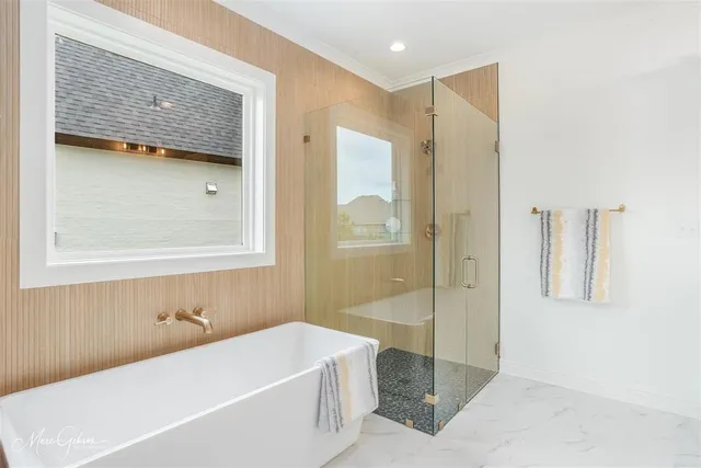 a bathroom with a bathtub and a shower