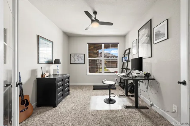 a workspace with furniture and window