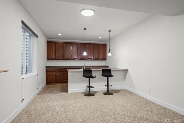 a kitchen with a sink cabinets and window