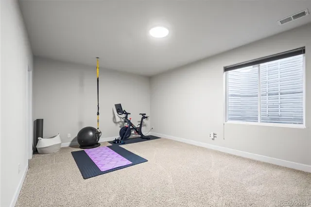 a bathroom with a double vanity sink toilet and shower