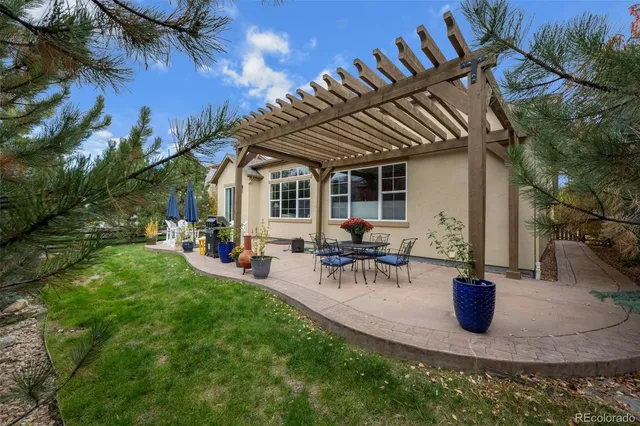 a group of people sitting in a yard