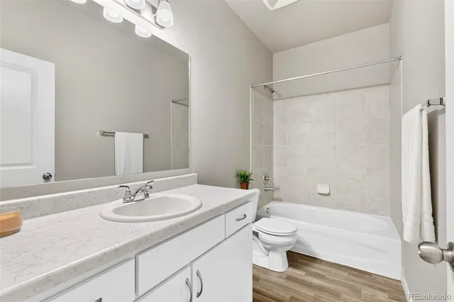 a bathroom with a sink toilet tub and shower