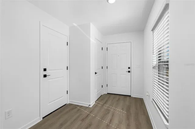 a view of a livingroom with wooden floor
