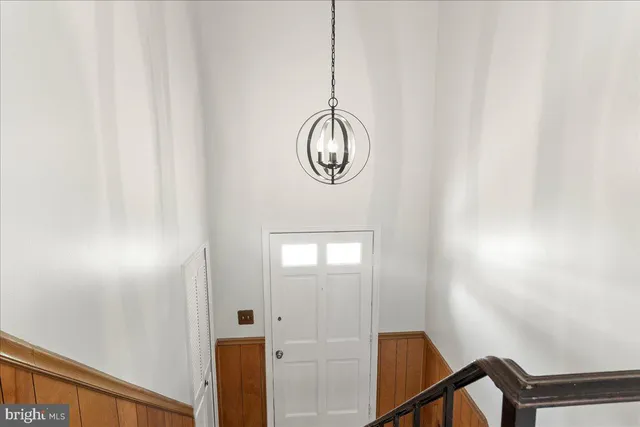 a front view of a mirror with wooden floor