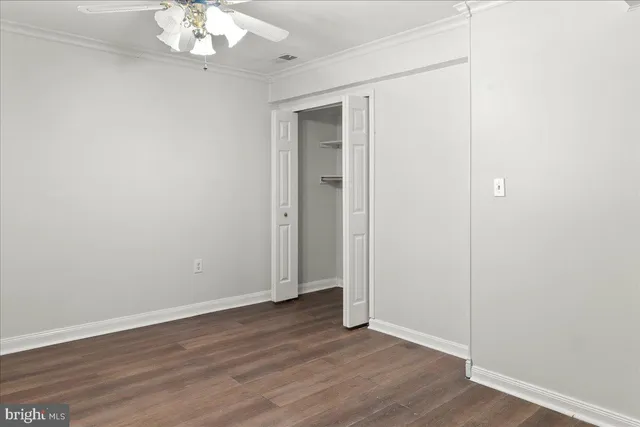 a front view of a building with glass windows and door