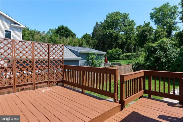 a front view of house with yard swimming pool and green space