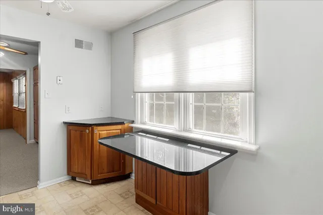 a room with a sink and a window