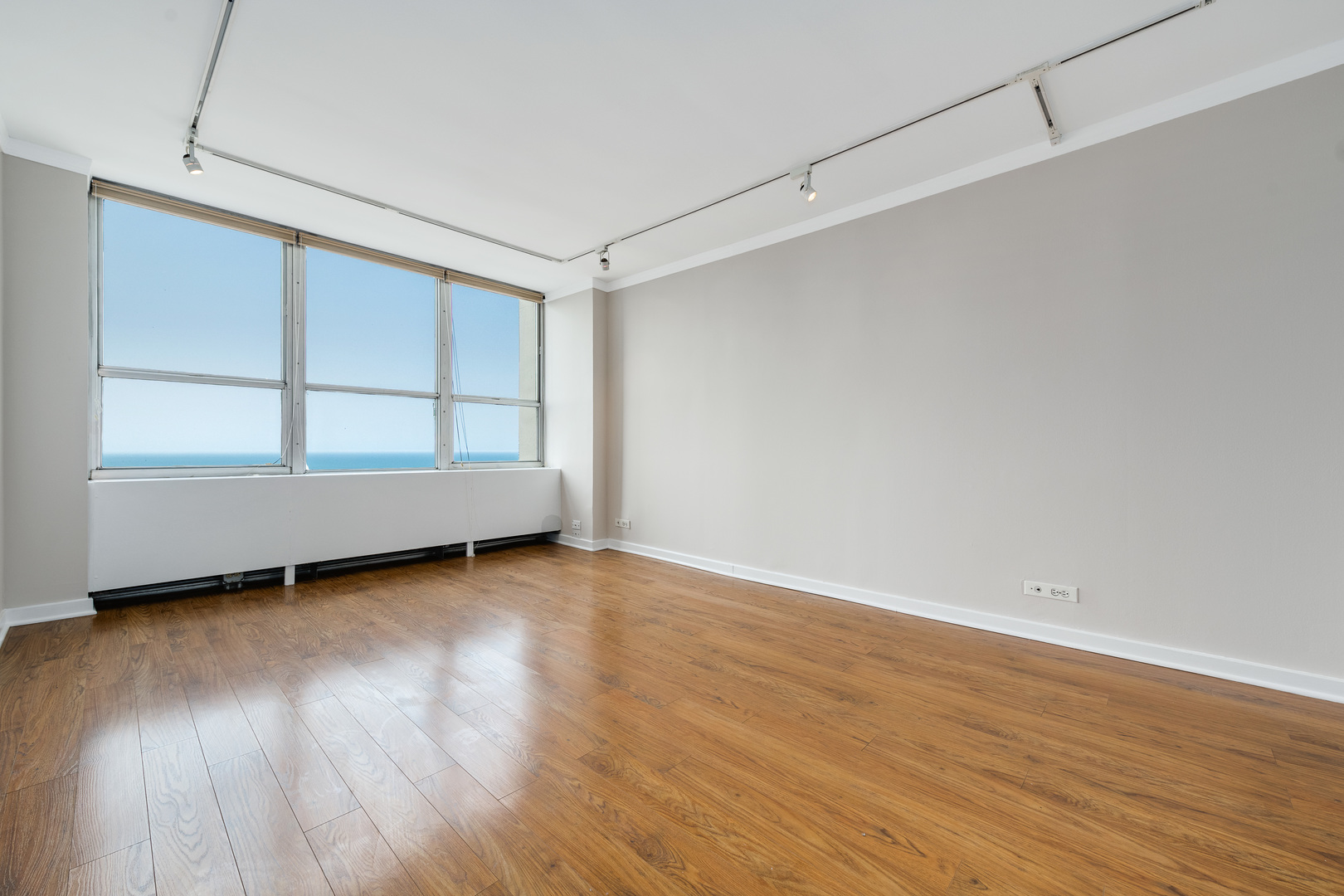 655 West Irving Park Road, Unit 5106 Chicago, IL 60613 - Photo 18 of 30 a view of a room with wooden floor and closet