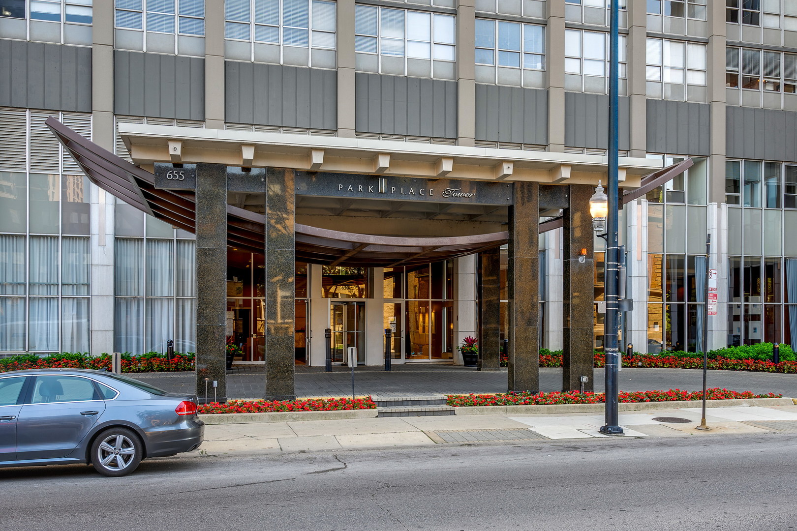 655 West Irving Park Road, Unit 5106 Chicago, IL 60613 - Photo 2 of 30 a car parked in front of a building