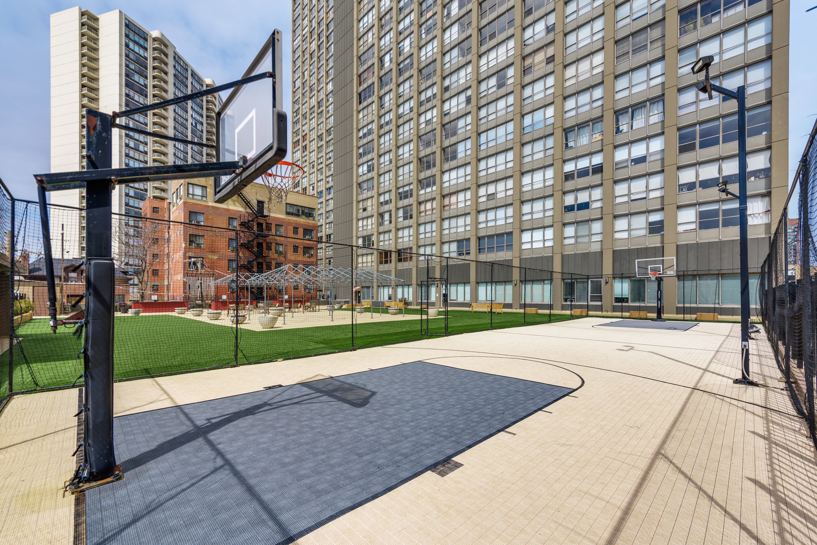 655 West Irving Park Road, Unit 5106 Chicago, IL 60613 - Photo 27 of 30 a view of a building with a yard