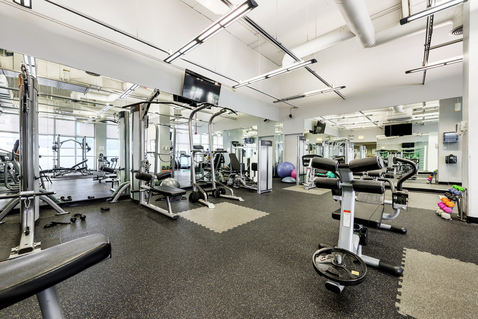 655 West Irving Park Road, Unit 5106 Chicago, IL 60613 - Photo 28 of 30 a view of a room with gym equipment
