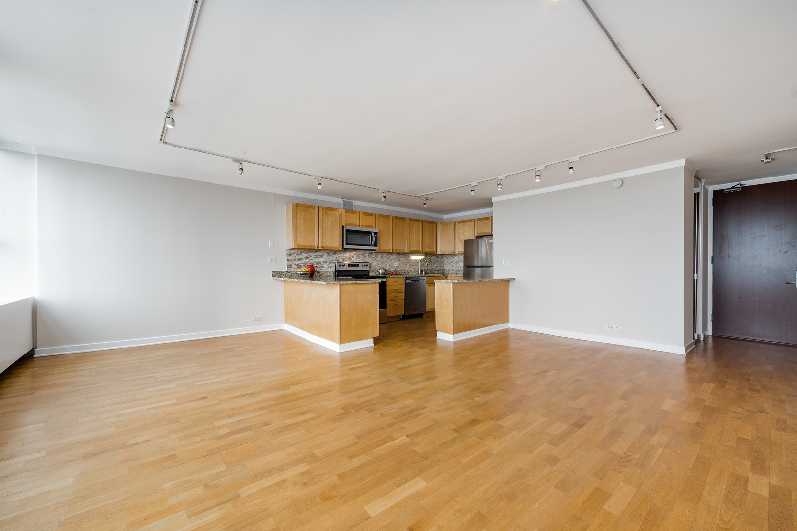 655 West Irving Park Road, Unit 5106 Chicago, IL 60613 - Photo 4 of 30 a view of kitchen with furniture and wooden floor