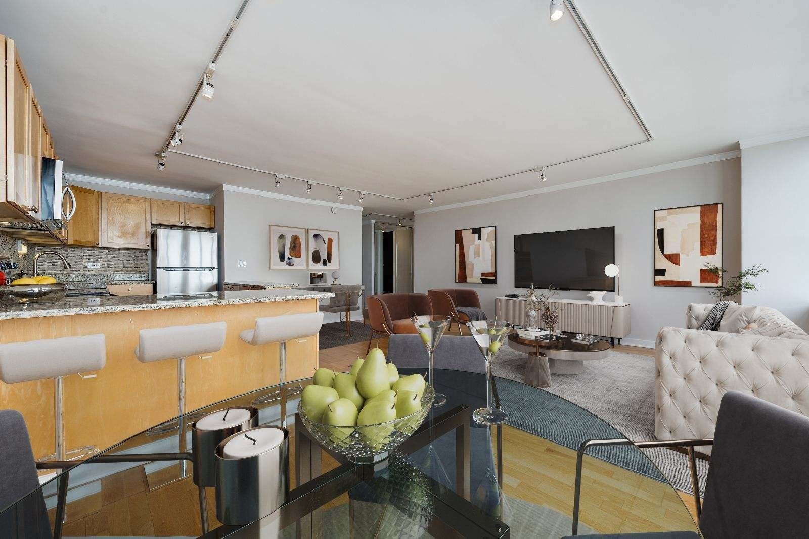 655 West Irving Park Road, Unit 5106 Chicago, IL 60613 - Photo 7 of 30 a living room with furniture kitchen view and a flat screen tv