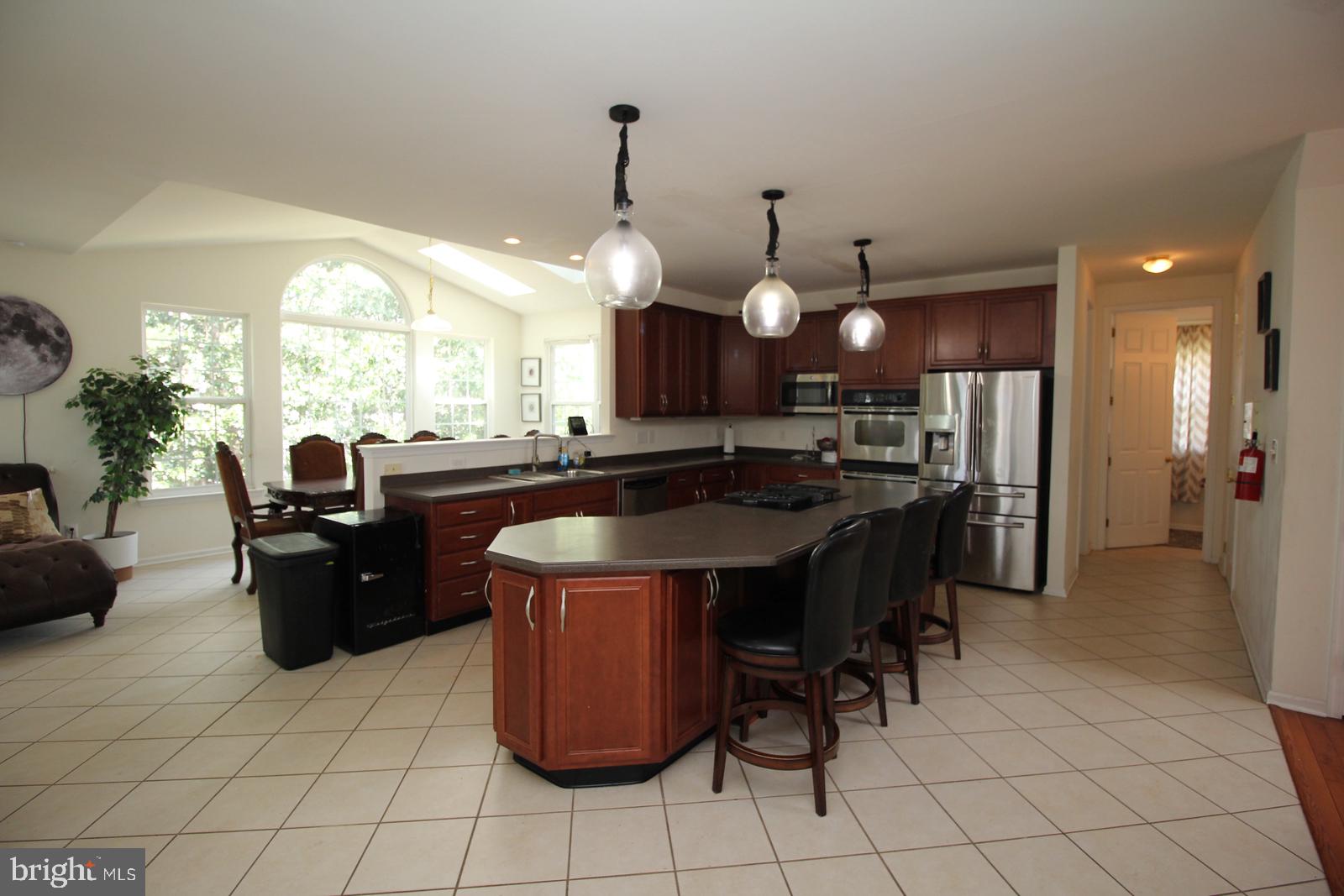 5 Kelly Drive Sicklerville, NJ 08081 - Photo 12 of 32 a kitchen with a sink a counter top space and appliances