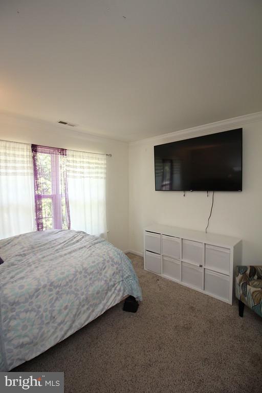 5 Kelly Drive Sicklerville, NJ 08081 - Photo 17 of 32 a bedroom with a bed and a flat screen tv