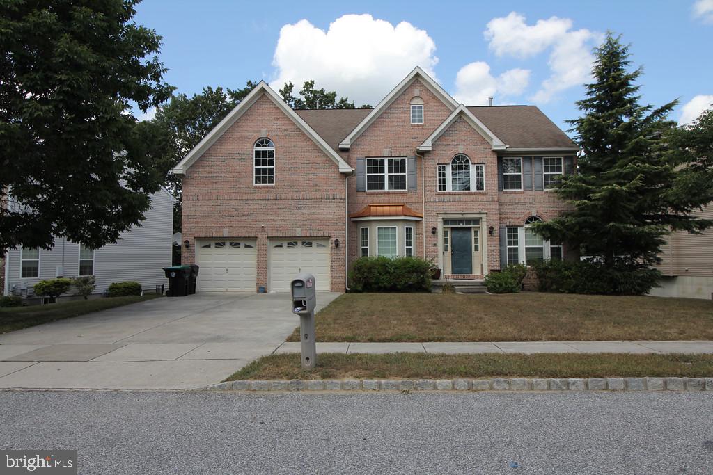 5 Kelly Drive Sicklerville, NJ 08081 - Photo 2 of 32 a front view of a house with a yard and garage