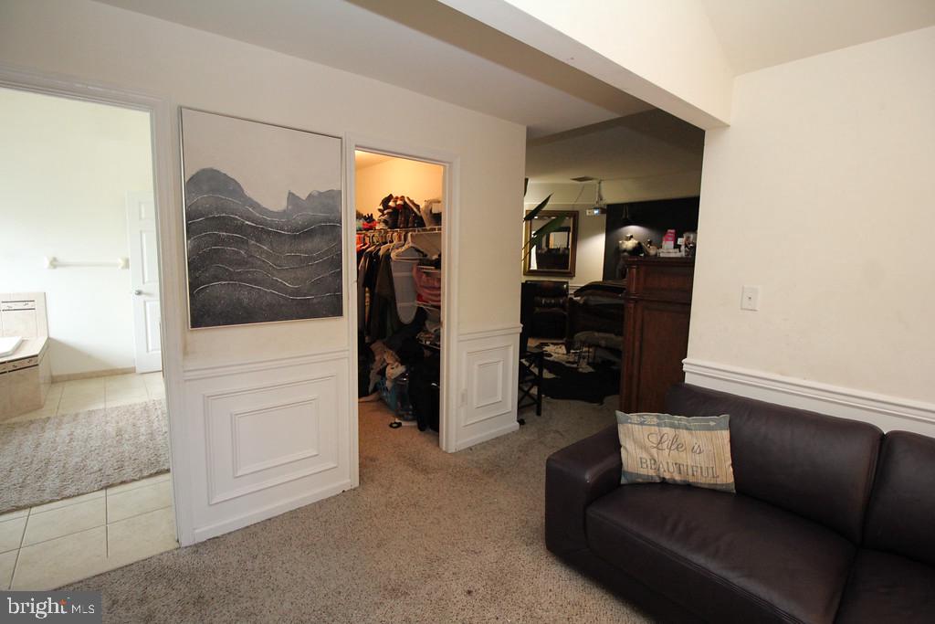 5 Kelly Drive Sicklerville, NJ 08081 - Photo 23 of 32 a living room with furniture and a walk in closet