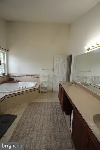 a kitchen with a sink and a stove top oven