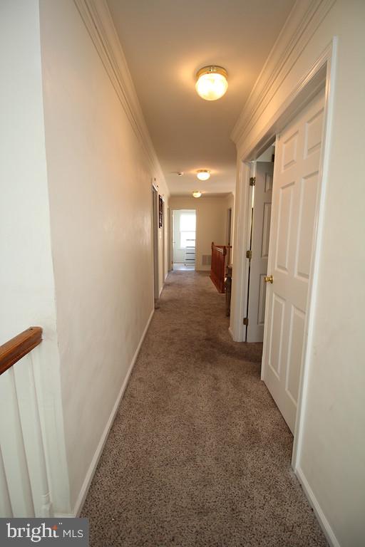 5 Kelly Drive Sicklerville, NJ 08081 - Photo 27 of 32 a view of a hallway with wooden shelves