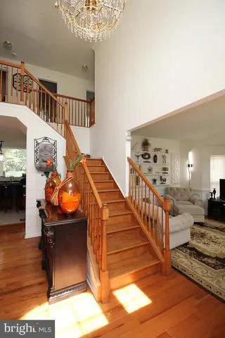a view of a livingroom with furniture and staircase