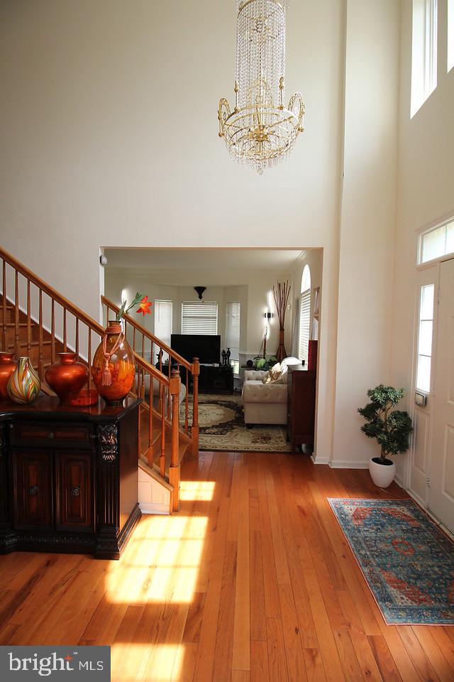 5 Kelly Drive Sicklerville, NJ 08081 - Photo 6 of 32 a living room with furniture and a chandelier
